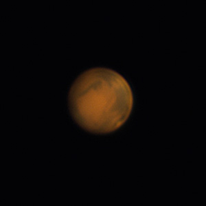 Aktuelle Marsaufnahme bei gutem Seeing vom 12.3.2014, 2:47 MEZ. Auf der rechten Seite des Planeten sind gut Mare Erythraeum (oben) und Mare Acidalium (unten) zu erkennen. Von der Nordpolkappe ist nur noch eine leichte Aufhellung erkennbar (unten). Digitalfoto, 8"-SCT bei ca. 8000mm, Skyris 618c, UV-/IR-Sperrfilter. 3000 von 8000 Bildern in Registax und Photoshop bearbeitet. Ronny Rohloff